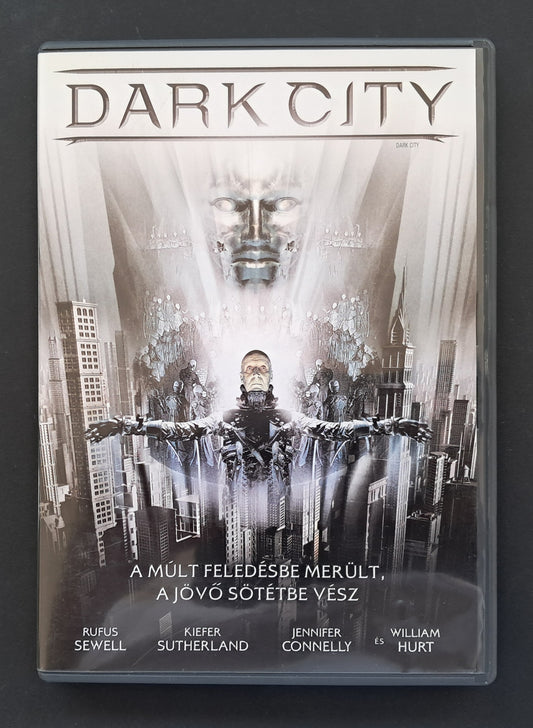 DVD cover of 'Dark City' with a futuristic cityscape and central figure.
